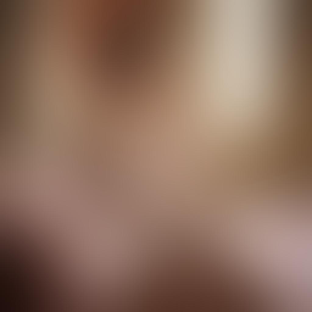 A soft-focused, ethereal scene depicting a model adorned in elegant lingerie, bathed in warm, ambient light, accentuating the delicate lace and satin textures. The background features subtle pastel colors and floral motifs, creating an enchanting atmosphere that embodies femininity. Gentle shadows play across the model's silhouette, enhancing an aura of allure and grace. The composition should evoke a sense of intimacy and elegance. super-realistic. vibrant colors. soft focus.